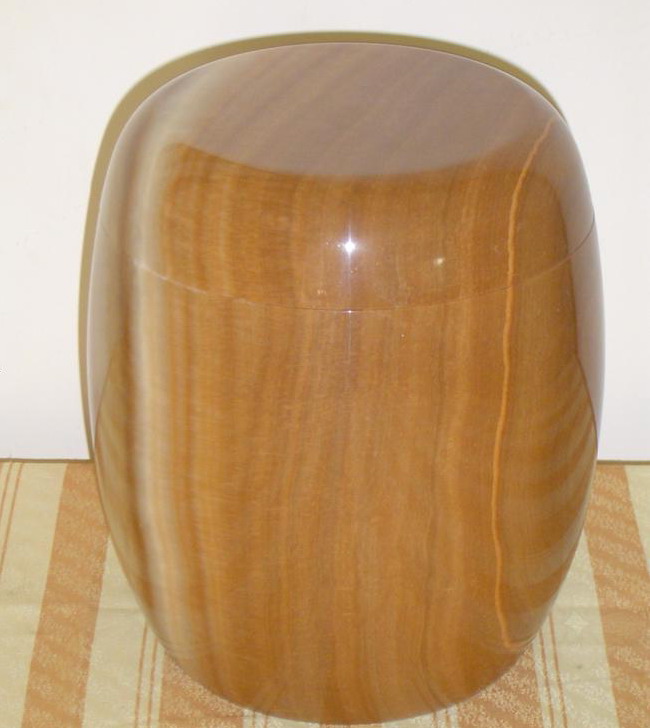 yellow wooden marble urn