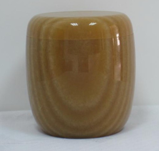 yellow wooden marble urn