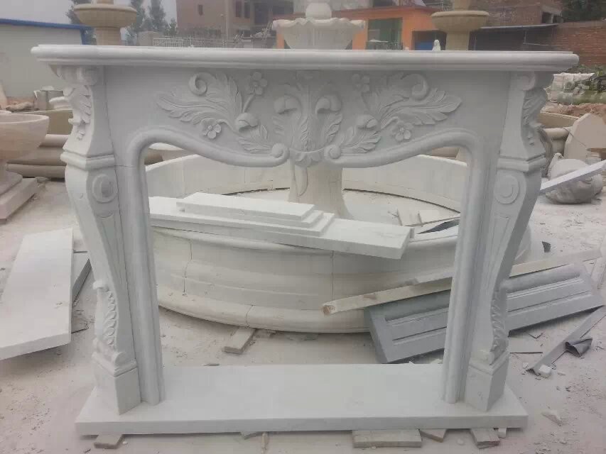 White marble carved fireplace mantel